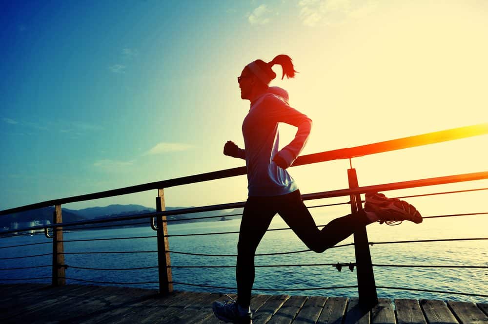lifestyle sports woman running on wooden boardwalk - How to avoid the risks of Running as a beginner and boost your body
