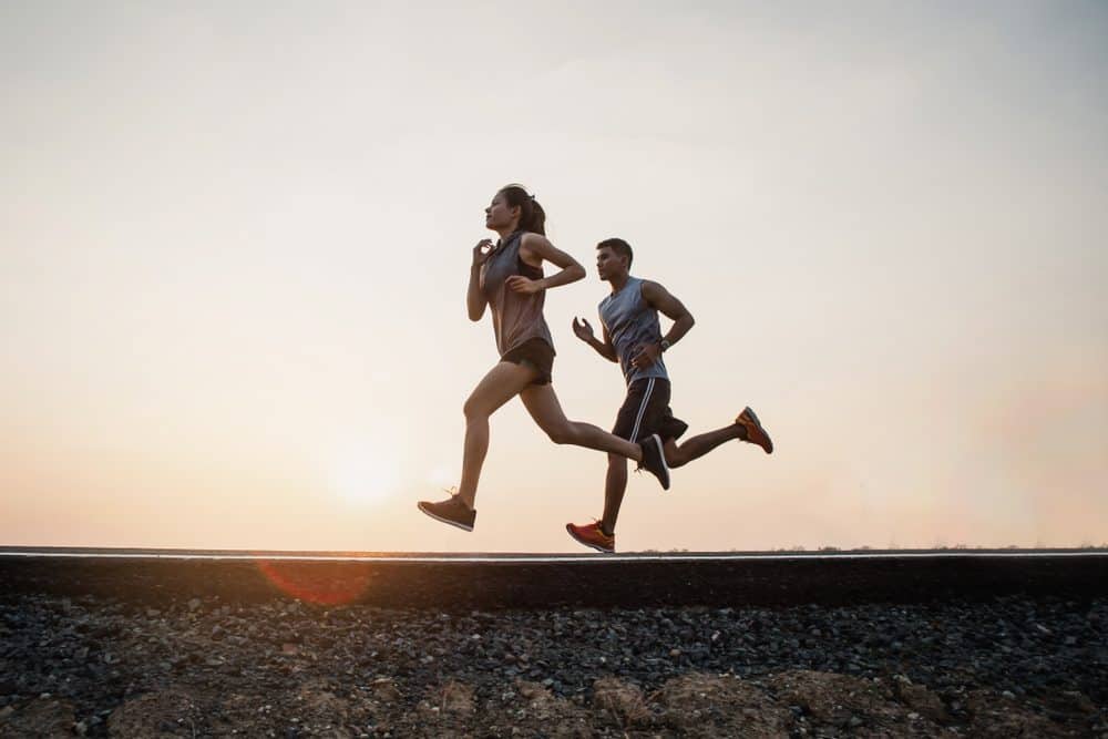 Young couple Exercise Running running on the street - How Frequently Should a Beginner Exercise Running to Achieve Best Results for the Body and Avoid Injuries Explained