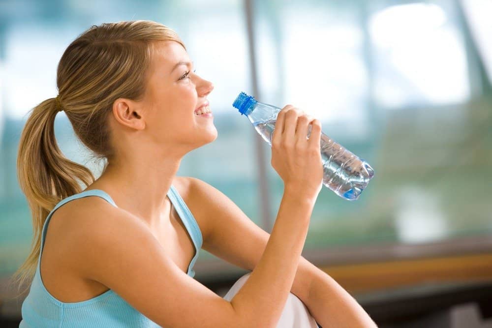 girl holding water bottle