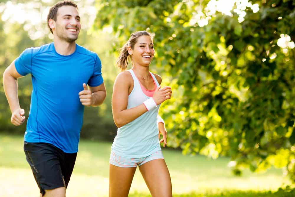 Young happy couple running - How to Start Running As a Beginner