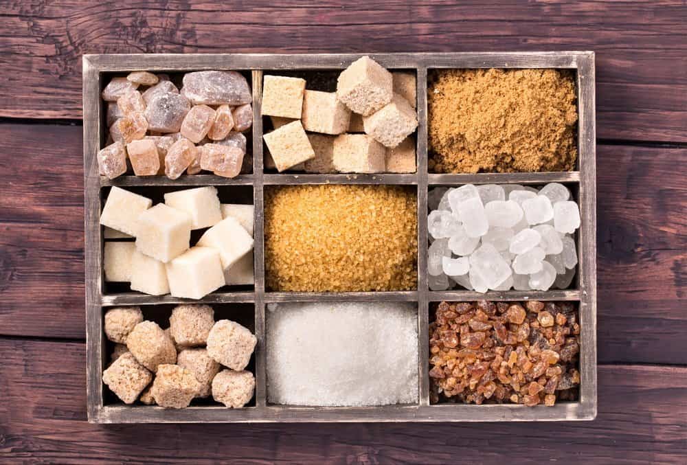Various kinds of sugar in box on old wooden background - Diet Smoothies for Weight Loss