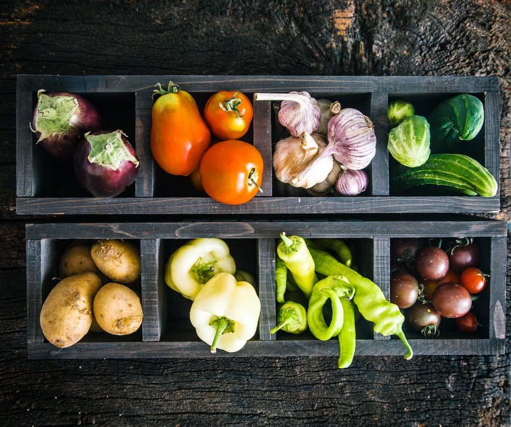 Vegetables on wood. Organic vegetables in rustic setting. Fresh food. Healthy veggies - Fatty fish - Is Mediterranean diet the healthiest in the world?
