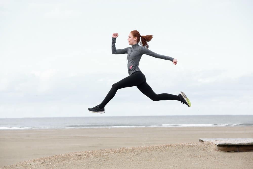 Fit young woman running and jumping - Is Mediterranean diet the healthiest in the world?