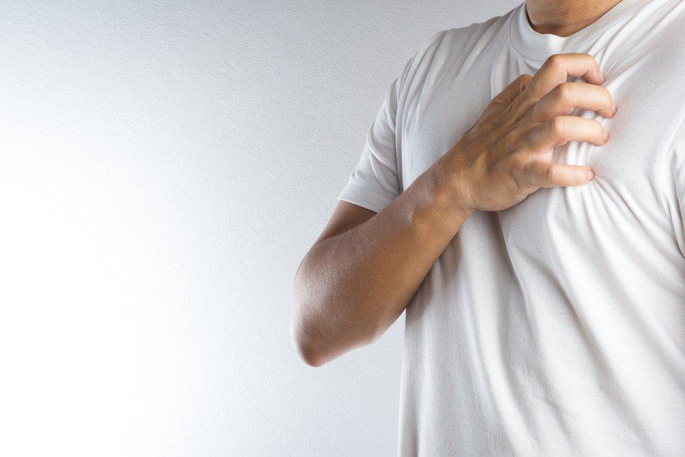 Man with chest pain - Signs You're Overdoing Cardio