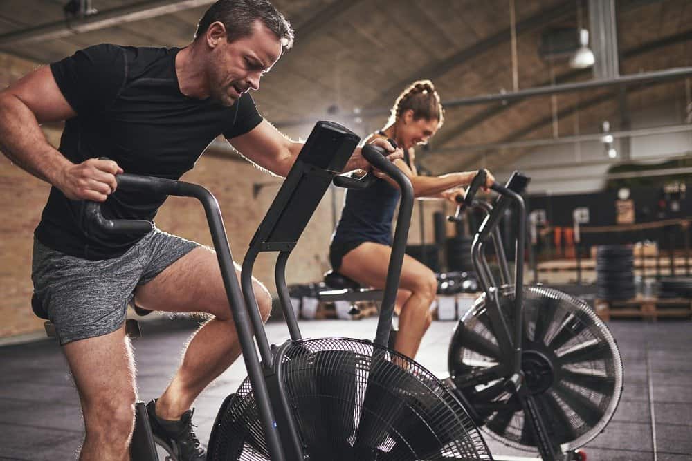 Young man and woman wearing training - Signs You're Overdoing Cardio