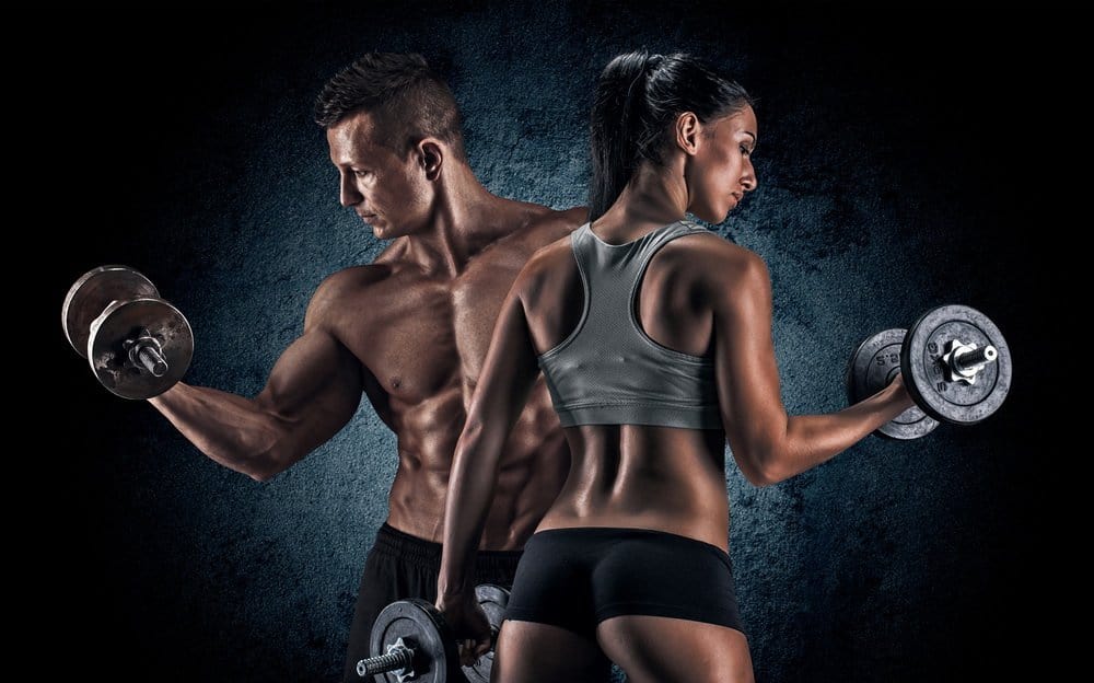 Man and woman lifting dumbells - Best Strength Training Workout