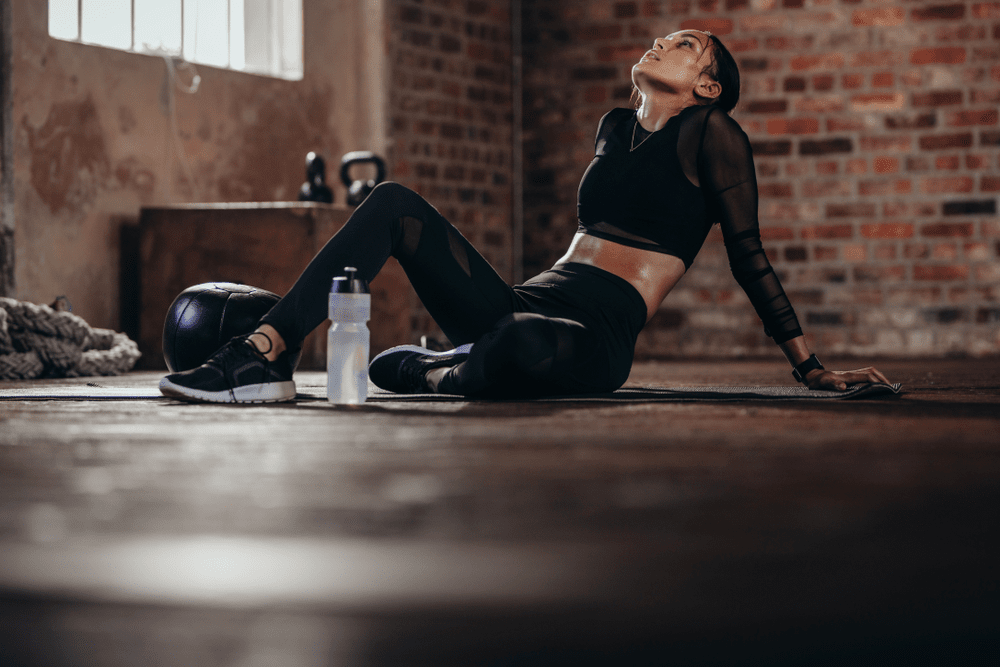 girl wearing black dress relaxing after exercise