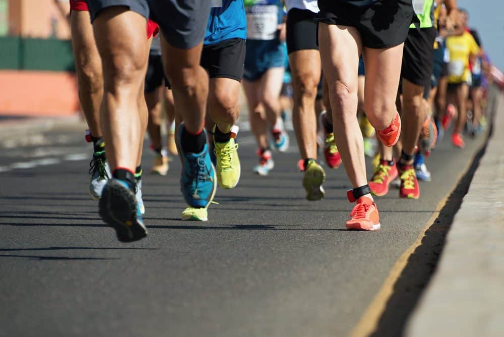 Marathon running on city road - How Frequently Should a Beginner Exercise Running to Achieve Best Results for the Body and Avoid Injuries Explained
