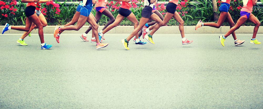 Marathon running race on city road - How Frequently Should a Beginner Exercise Running to Achieve Best Results for the Body and Avoid Injuries Explained