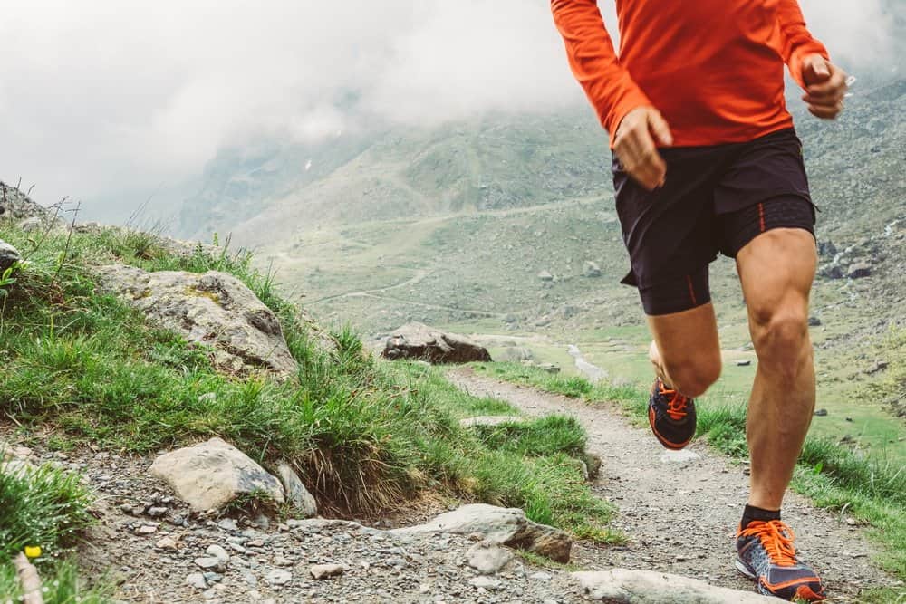 A young runner is running uphill - Top Effective Tips on How to Improve Your Body’s Running Skills