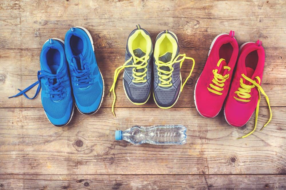 Various pairs of colorful running shoes - Running Gear for Beginners