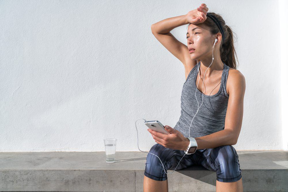 Exhausted Asian runner dehydrated feeling exhaustion and dehydration from working out at gym - 10 Reasons why Water is Important