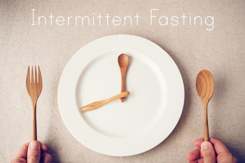 white plate with spoon and fork, Intermittent fasting concept - Lose Weight Naturally Fast