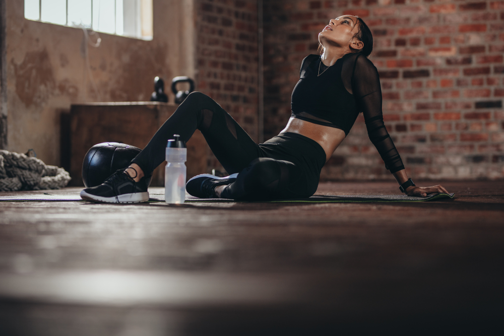 girl wearing black dress relaxing after exercise
