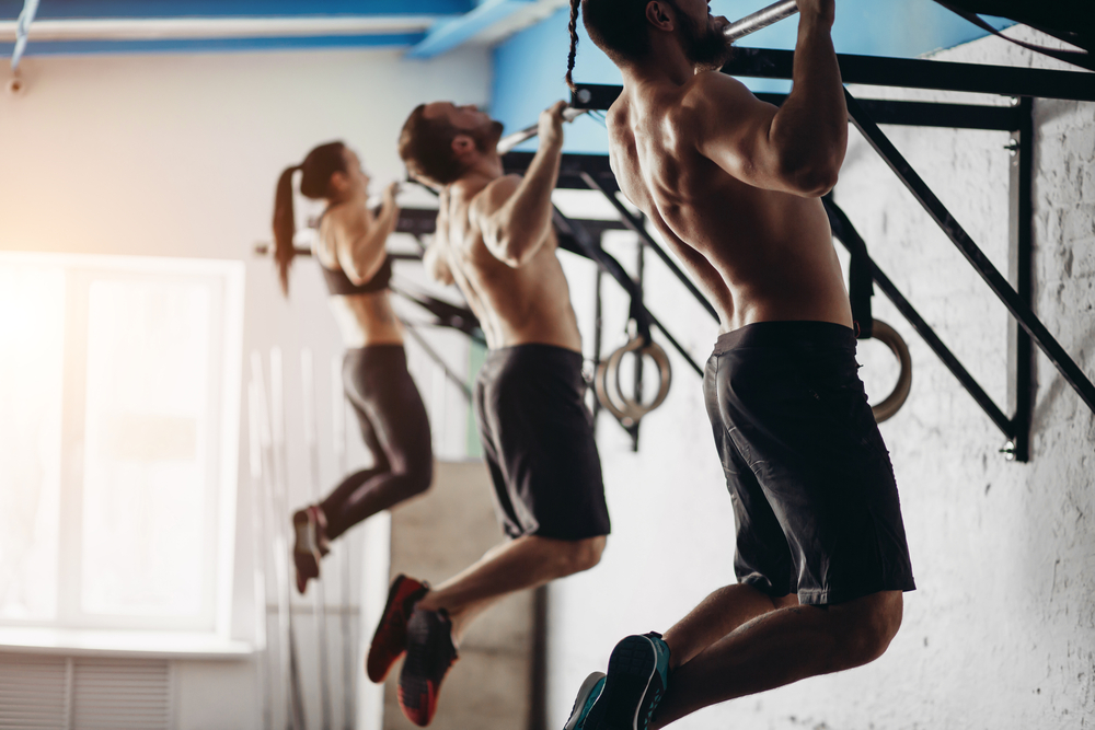 Adults doing cross fit training in the gym - How Frequently Should a Beginner Exercise Running to Achieve Best Results for the Body and Avoid Injuries Explained