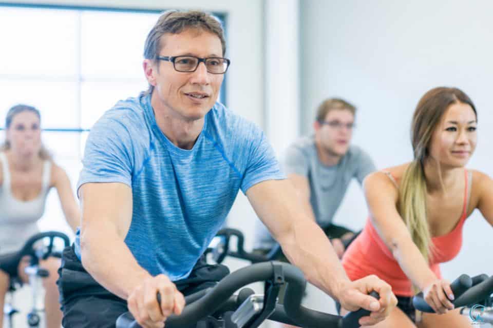 You can simulate outdoor riding conditions with indoor cycling classes in a studio or gym.