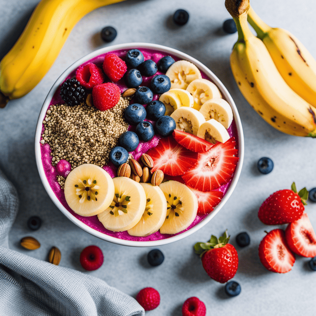 An image of a vibrant, colorful smoothie bowl topped with sliced bananas, chia seeds, and nuts