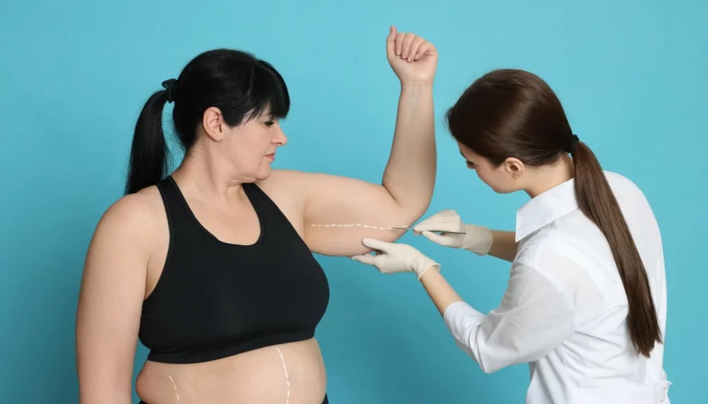  surgeon marking a patient's arm before surgery - What is Your Metabolic Age: What is It, and How Do You Calculate it?