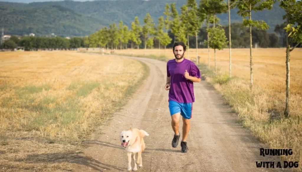 A young man running with his dog
