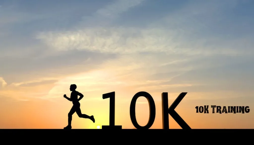 Silhouette of a runner at sunset nearing a 10K sign, representing the dedication and training required for a 10K race.