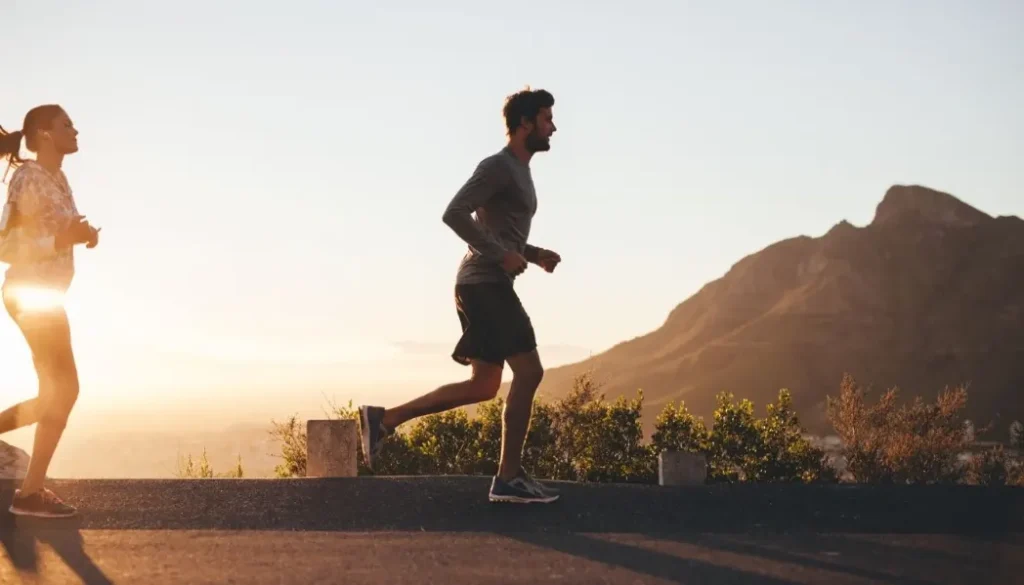 Trail runner on a rocky path, highlighting potential risks and injuries for beginner runners, promoting safety and awareness.