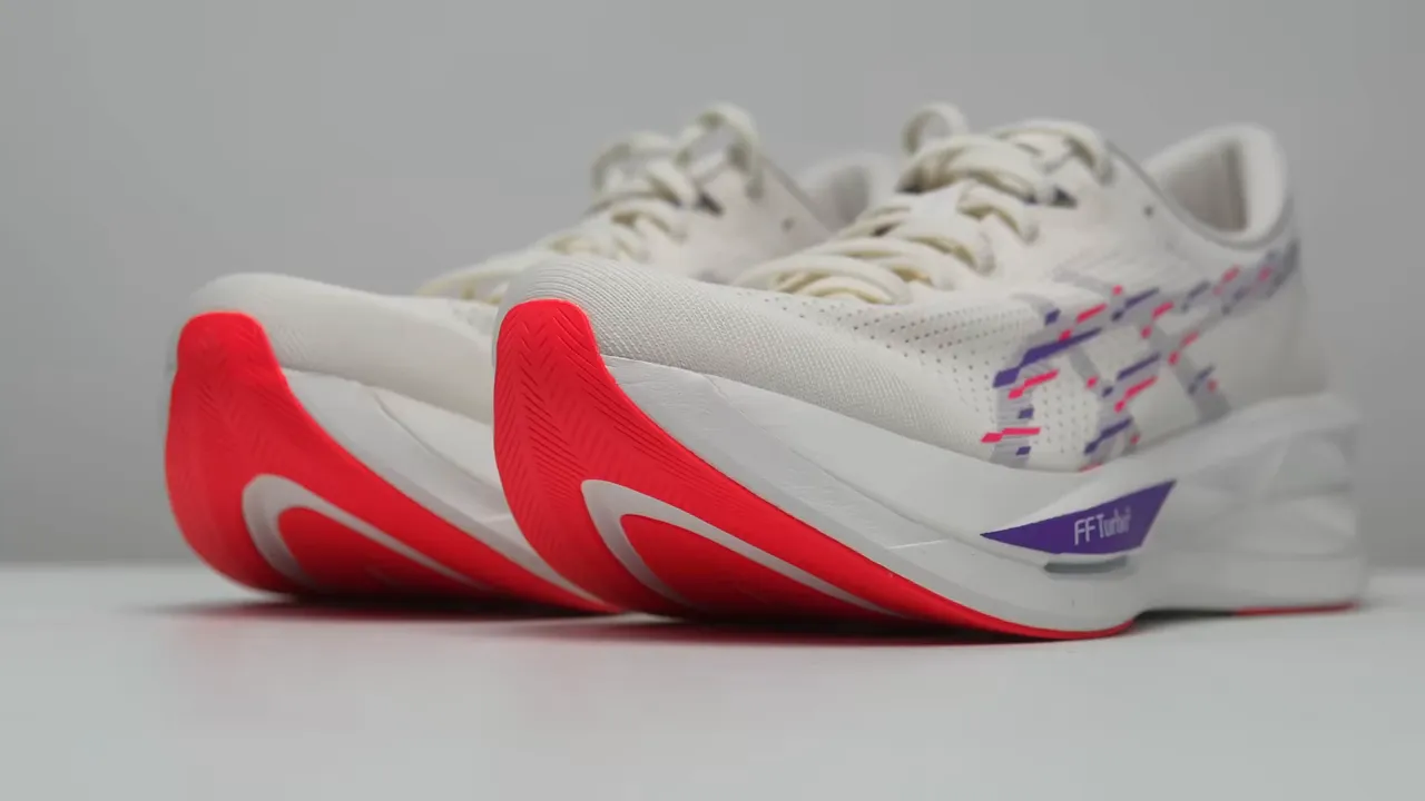 Close-up of outsole showing exposed foam and window revealing Astro plate