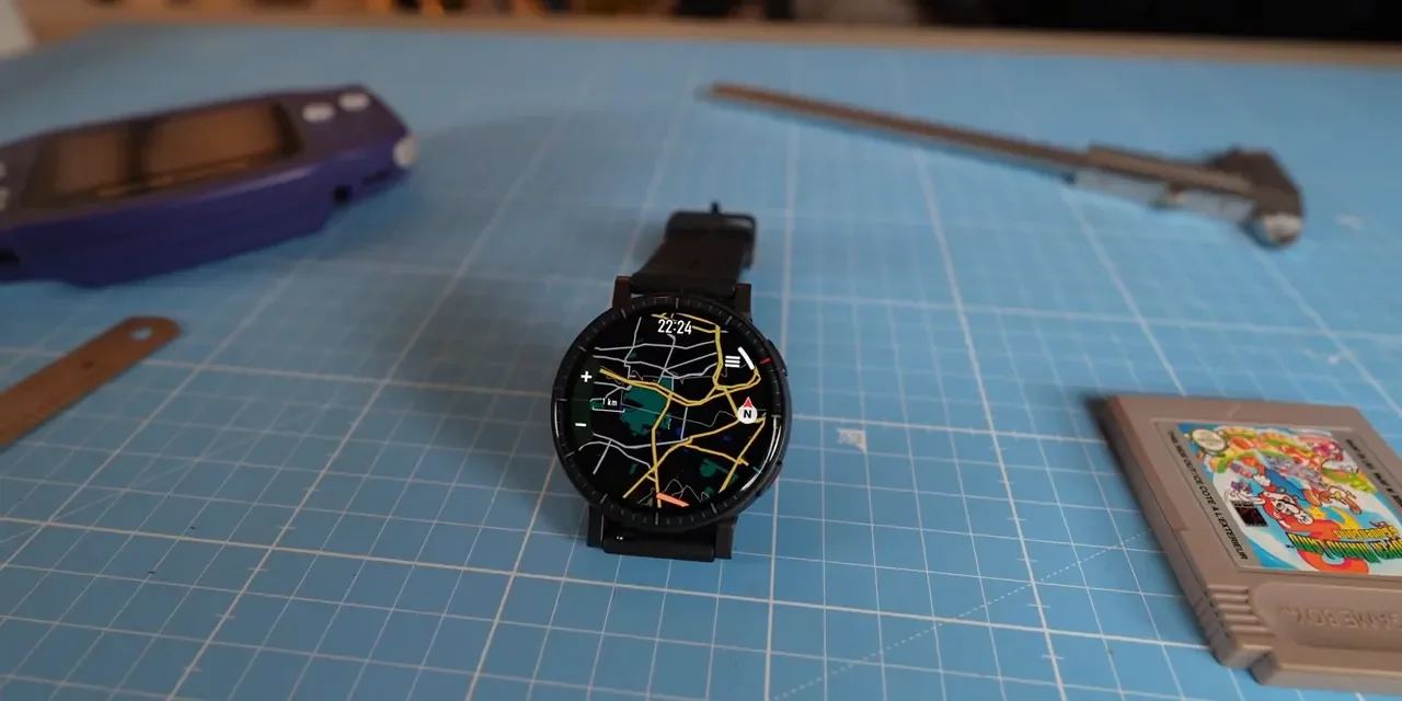 Amazfit Active Max displaying a detailed map on its round AMOLED screen placed on a grid cutting mat.