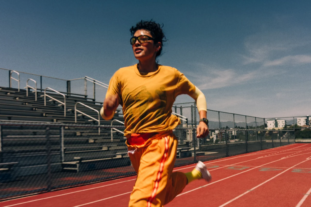 Runner on a track wearing the Apple Watch Series 12